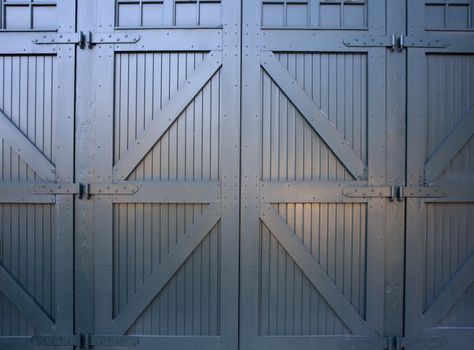 old fashioned, heavy, wooden gates to industrial building (railroad maintenance)