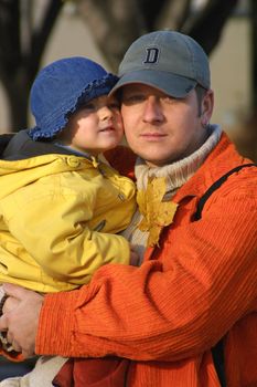 father with her daughter for a walk autumn