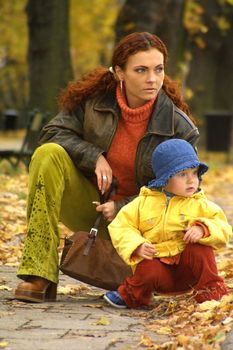 mother with her daughter for a walk autumn