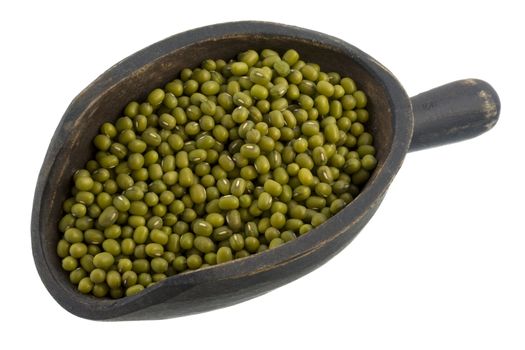 mung beans on a primitive, wooden, dark painted scoop, isolated on white