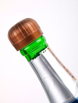 Top on wine bottle. Close up on white background
