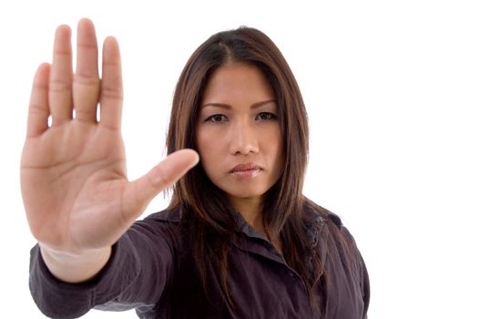 young female asking to stop against white background