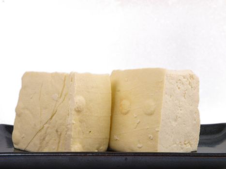 Fresh Chinese tofu. Close up on white background