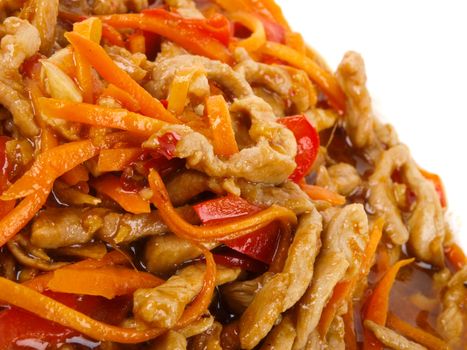 Chinese fried pork meat with pepper and carrot