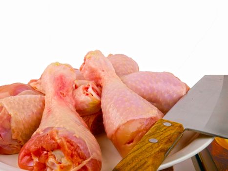 Fresh raw chicken legs. Close up on white background