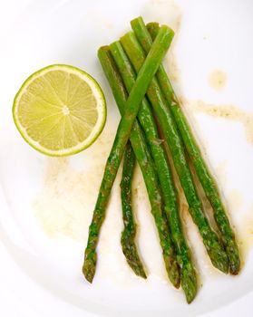 green asparagus. Close up. Lemon in background