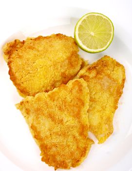 Fish Filet with lemon. Close up on white background