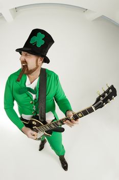 An image of a Leprechaun playing electric guitar.
