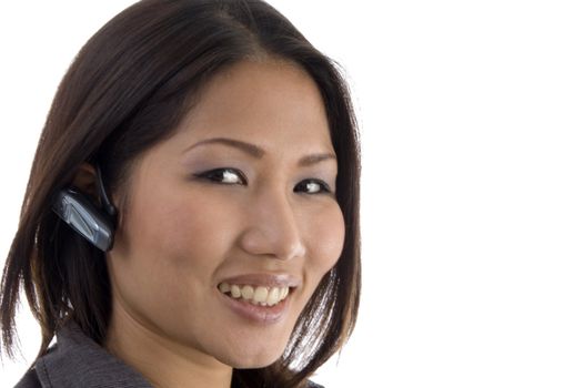 close up of female using bluetooth device on an isolated white background