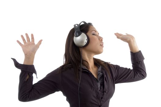 female enjoying music on headphone with white background