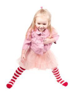 Studio shot of little girl, positive, playing