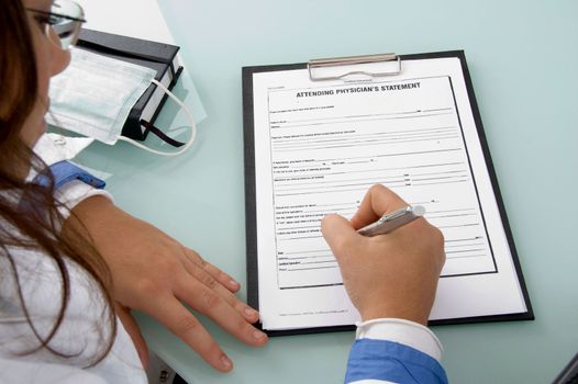 back pose of doctor writing on notepad on an isolate background