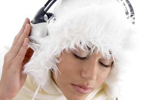 youth girl listening to music with headphones against white background