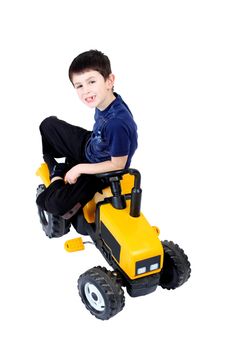 small boy on the yellow tractor isolated on white background