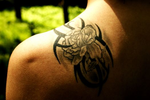 very nice girl tatoo on shoulder in sun