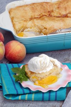 Delicious homemade peach cobbler with fresh peaches.