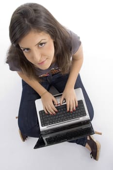 pretty woman working on laptop on an isolated white background
