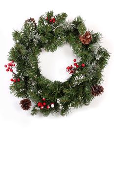 Holiday wreath christmas with red berries and Cones