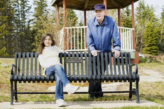 Old man and granddaughter enjoying outdoors