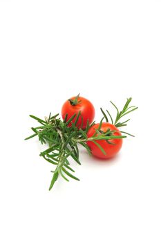 Two Cherry Tomatoes and Thyme branches on a light colored background