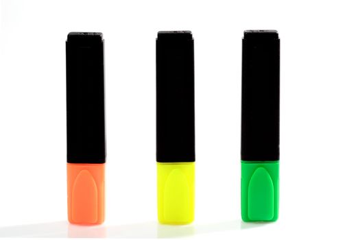 Yellow, green and orange highlighter on bright background