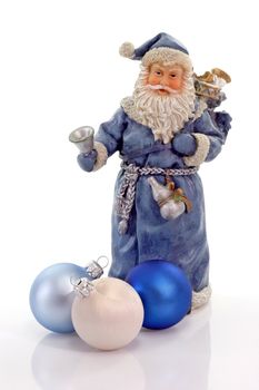 Blue Santa Claus figure with three christmas tree balls on light background