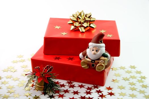 Red christmas gifts with dedoration on light background