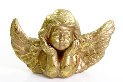 Close up of a golden cherub on bright background