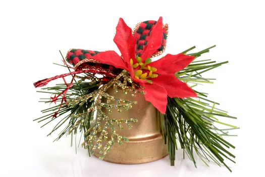 Close up of a golden christmas bell on bright background