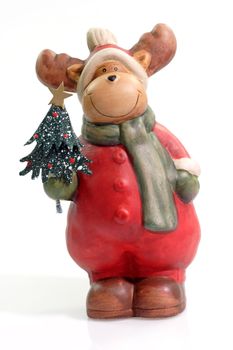 Figurine of a reindeer on bright background