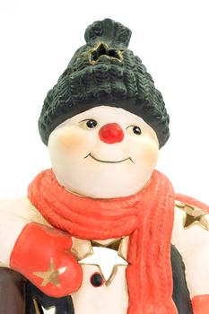 Close up of a snowman figurine on bright background