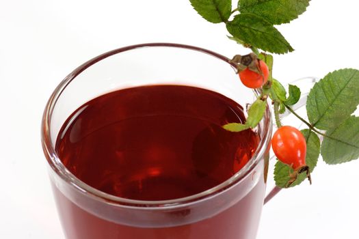 Close up of a glass of rosehip tea on bright background