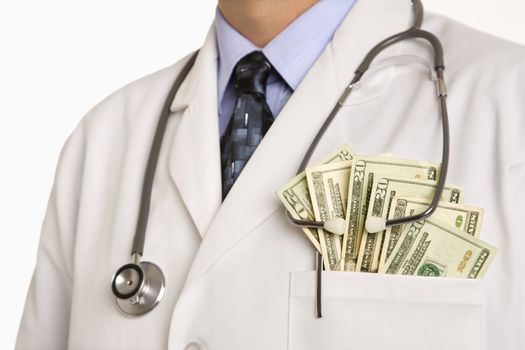 Caucasian mid adult male physician with cash hanging out of pocket.