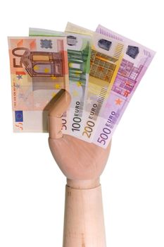 Wooden hand holding Euro bills on white background