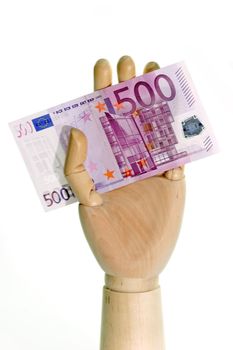 Wooden hand holding a 500 Euro bill on white background