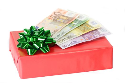 Red present with green ribbon and Euro bills