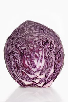 Half of a red cabbage on light Background