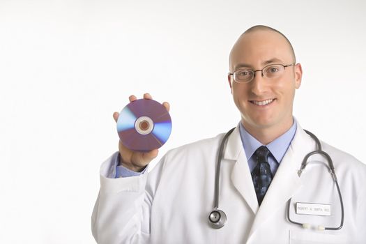 Caucasian mid adult male physician holding compact disc.