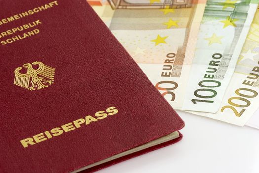 Passport with European bank notes on white background