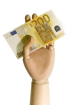Wooden hand holding a 200 Euro bill on white background