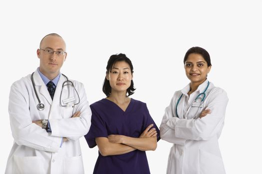 Caucasian mid adult male physician with Asian and Indian women doctors.