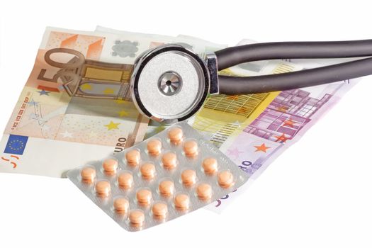 Stethoscope and pills on Euro bills - isolated on white background