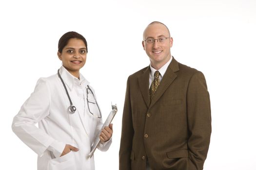 Indian mid adult woman doctor with man in business suit.