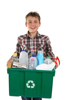 A happy smiling boy carrying a container bin of cans and bottles suitable for recycling.  White background.