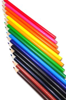 Colored pencils in various color shades in a vertical view