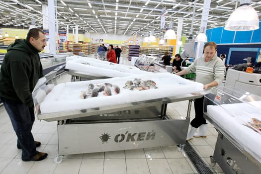 KYIV, UKRAINE - NOVEMBER 13: Worker in supermarket during prepare to opening first store of OK supermarket network on November 13, 2007 in Kyiv, Ukraine.