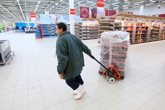 KYIV, UKRAINE - NOVEMBER 13: Worker in supermarket during prepare to opening first store of OK supermarket network on November 13, 2007 in Kyiv, Ukraine.