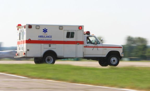 VINNYTSYA, UKRAINE - JUNE 10, 2008: Ambulance driving fast during a medical military trainings  on June 10, 2008 in Vinnytsya, Ukraine