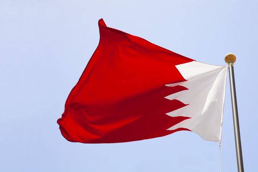 Image of a Bahrain flag flying high.
