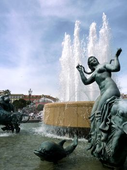 Statue of a woman of the fountain at Massena place, Nice, France